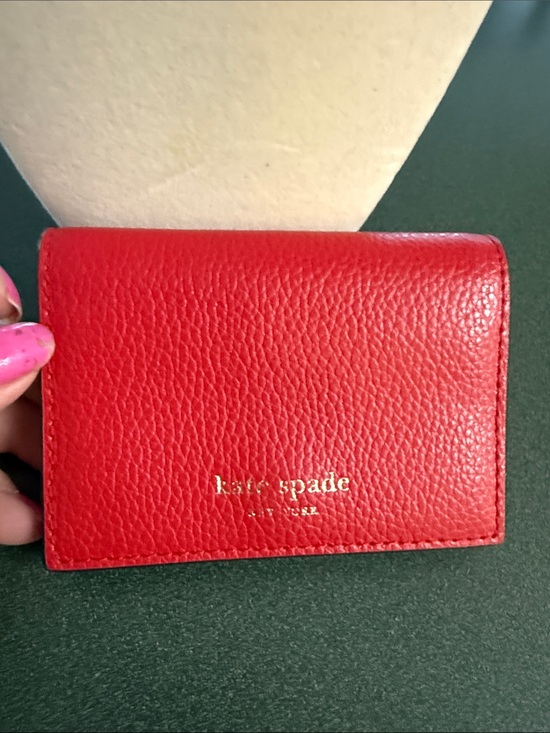 kate spade Handbags - kate spade Red Pebbled Leather Card Case with Gold Logo